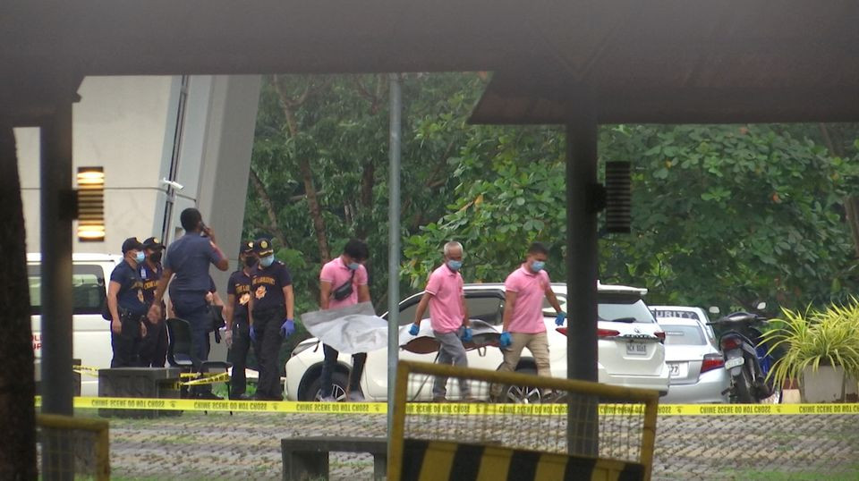 police investigators carry the body of one of the three people who died during a shooting at the ateneo de manila university in quezon city metro manila philippines july 24 2022 photo reuters