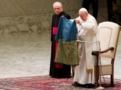 pope kisses ukrainian flag condemns the massacre of bucha