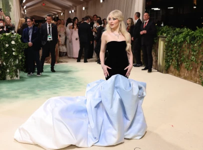 sabrina carpenter working late in met gala gown