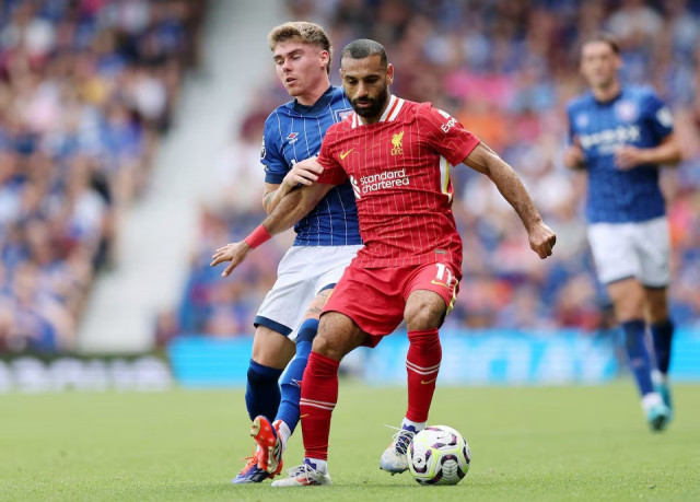 liverpool s mohamed salah in action with ipswich town s leif davis in their premier league opening at portman road ipswich britain on august 17 2024 photo reuters liverpool s mohamed salah in action with ipswich town s leif davis in their premier league opening at portman road ipswich britain on august 17 2024 photo reuters