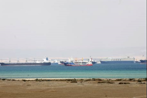 Ships are seen at the entrance of the Suez Canal, Egypt March 26, 2021. PHOTO: REUTERS