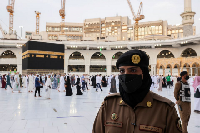 a saudi police female officer stands guard as pilgrims perform final tawaf during the annual haj pilgrimage in the holy city of makkah saudi arabia july 20 2021 photo reuters a saudi police female officer stands guard as pilgrims perform final tawaf during the annual haj pilgrimage in the holy city of makkah saudi arabia july 20 2021 photo reuters