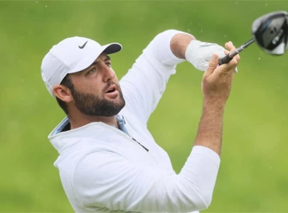 scheffler overcomes arrest for 66 but schauffele leads at pga