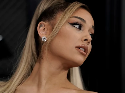 ariana grande stalks penn badgley in a you and gotham city inspired the boy is mine music video