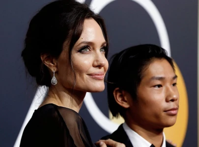 angelina jolie hasn t left son pax s side as he recovers from e bike accident