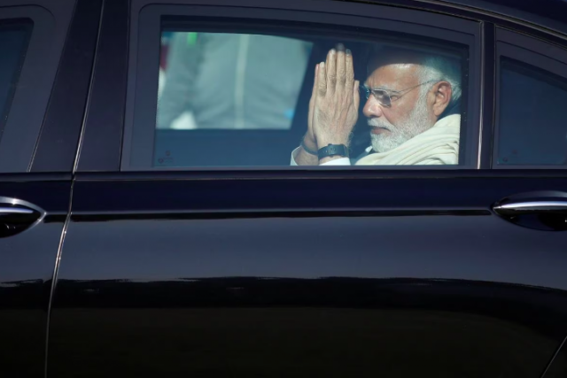 indian prime minister narendra modi gestures as he leaves in a car after attending the funeral of his mother heeraben in gandhinagar india december 30 2022 photo reuters amit dave indian prime minister narendra modi gestures as he leaves in a car after attending the funeral of his mother heeraben in gandhinagar india december 30 2022 photo reuters amit dave