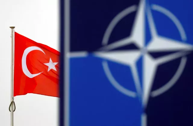 a turkish flag flies next to nato logo at the alliance headquarters in brussels belgium november 26 2019 photo reuters francois lenoir file photo a turkish flag flies next to nato logo at the alliance headquarters in brussels belgium november 26 2019 photo reuters francois lenoir file photo