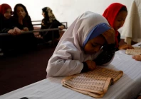 an afghan girl reads the koran in a madrasa or religious school in kabul afghanistan october 8 2022 photo reuters ali khara