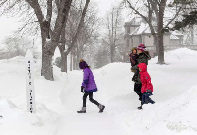 the motz family walks through blowing snow as weather conditions worsen in sioux falls south dakota u s february 22 2023 photo erin woodiel argus leader usa today network via reuters the motz family walks through blowing snow as weather conditions worsen in sioux falls south dakota u s february 22 2023 photo erin woodiel argus leader usa today network via reuters