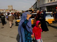 an afghan woman and a girl walk in a street in kabul afghanistan november 9 2022 photo reuters ali khara