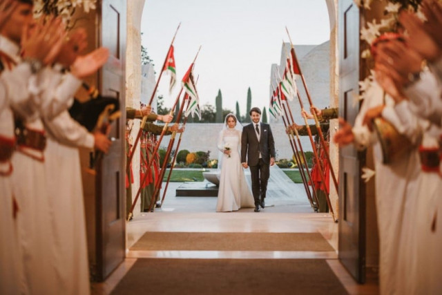 the bride and the groom princess iman and jameel alexander thermiotis receive an honour guard at their wedding ceremony in amman jordan in this handout picture obtained by reuters on march 12 2023 photo reuters the bride and the groom princess iman and jameel alexander thermiotis receive an honour guard at their wedding ceremony in amman jordan in this handout picture obtained by reuters on march 12 2023 photo reuters