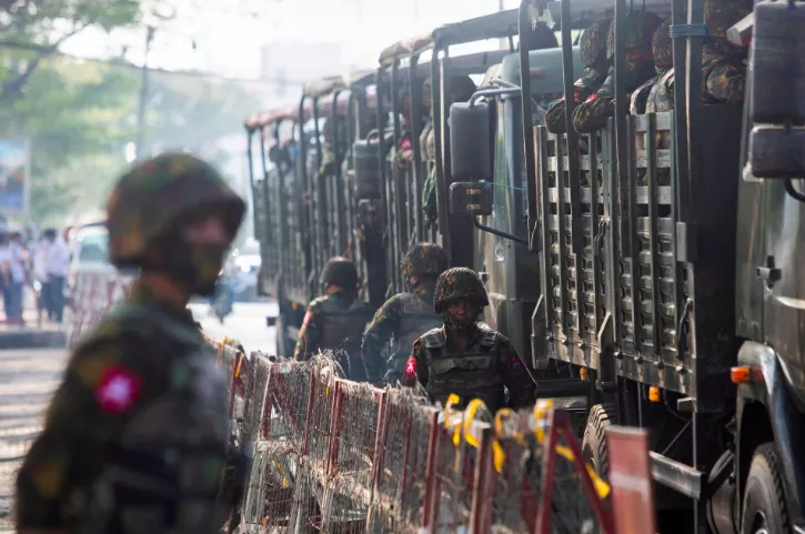soldiers stand next to military vehicles as people gather to protest against the military coup in yangon myanmar february 15 2021 photo reuters stringer file photo soldiers stand next to military vehicles as people gather to protest against the military coup in yangon myanmar february 15 2021 photo reuters stringer file photo