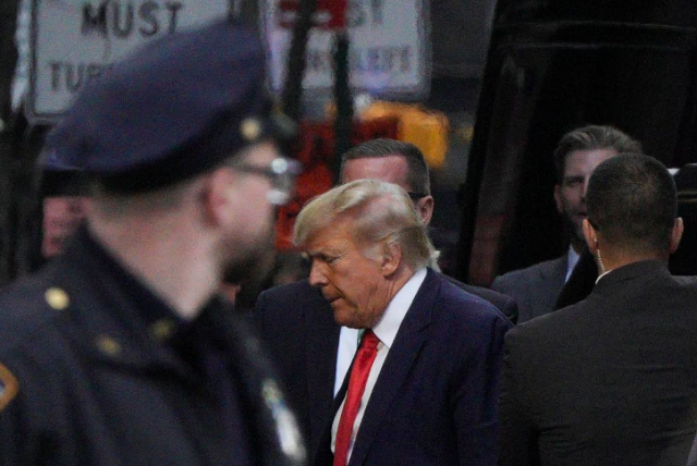 former us president donald trump and his son eric trump arrive at trump tower after former president trump s indictment by a manhattan grand jury following a probe into hush money paid to porn star stormy daniels in new york city us on april 3 2023 photo reuters jeenah moon