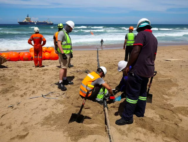 workers install the 2africa undersea cable on the beach in amanzimtoti south africa february 7 2023 photo reuters rogan ward workers install the 2africa undersea cable on the beach in amanzimtoti south africa february 7 2023 photo reuters rogan ward