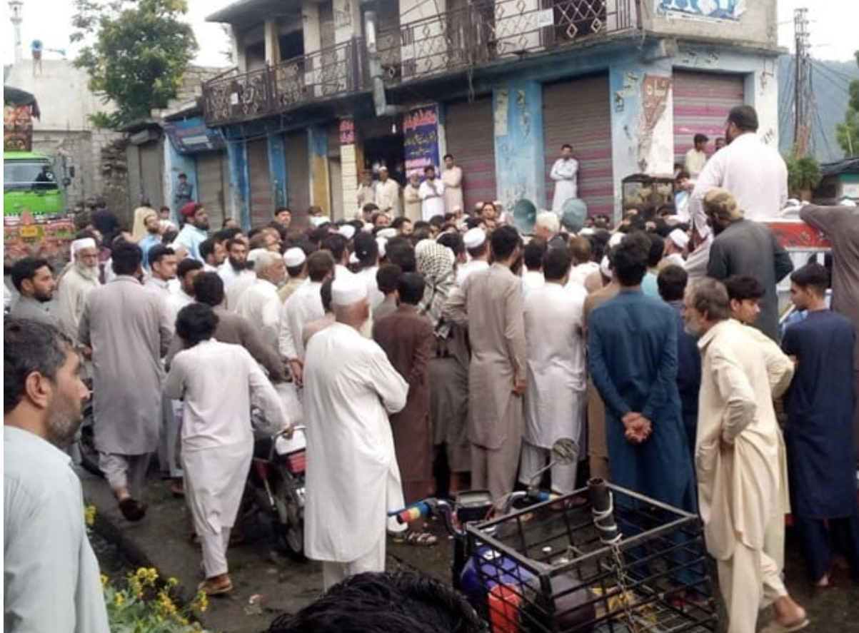 area residents and aggrieved family members gather in protest photo express