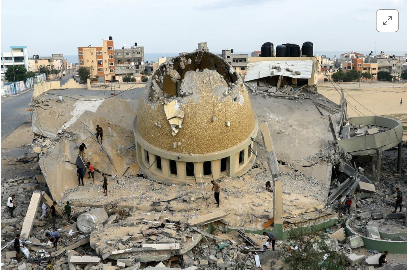 Palestinian inspect a mosque destroyed in Israeli strikes in Khan Younis, in the southern Gaza Strip, October 8, 2023. PHOTO: REUTERS