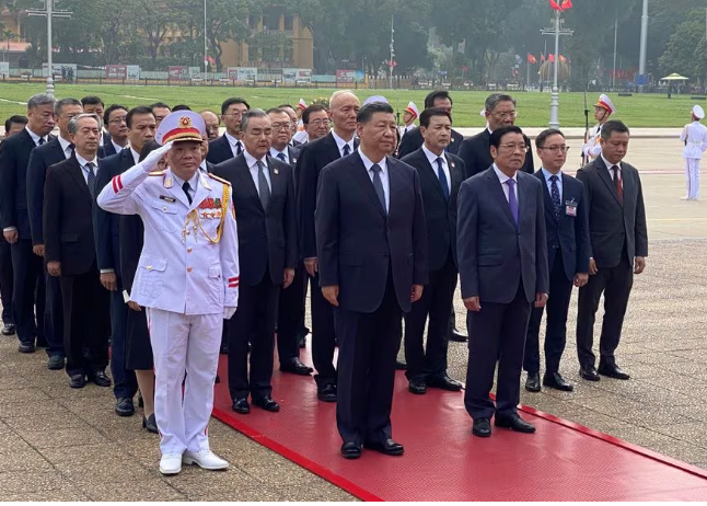 chinese president xi jinping attends a lay wreath ceremony at the ho chi minh mausoleum during a two day state visit to hanoi vietnam december 13 2023 reuters