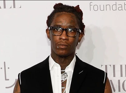 viral video shows young thug reacting to own music during rico trial