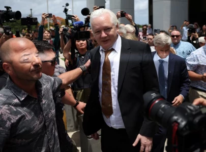 julian assange walks free after guilty plea in us court on pacific island