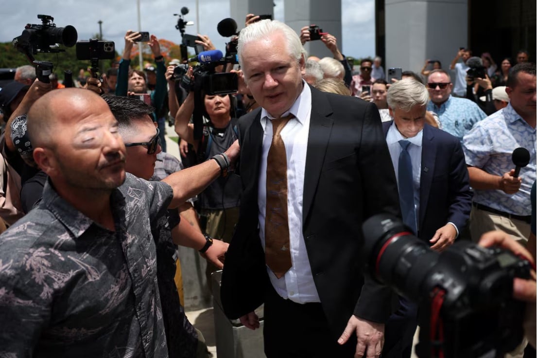 julian assange walks free after guilty plea in us court on pacific island