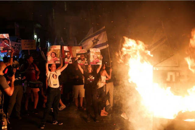 people protest on a day of strike and resistance amid the israel hamas conflict outside israeli prime minister benjamin netanyahu s residence in jerusalem june 27 2024 reuters people protest on a day of strike and resistance amid the israel hamas conflict outside israeli prime minister benjamin netanyahu s residence in jerusalem june 27 2024 reuters