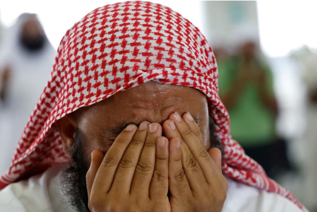 a muslim pilgrim prays during the annual haj pilgrimage in mina saudi arabia june 17 2024 reuters