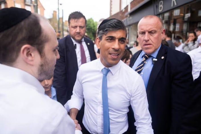 britain s prime minister rishi sunak leaves after visiting a bakery on the day of a visit to machzike hadath synagogue while on general election campaign trail in golders green london britain photo james manning pool via reuters