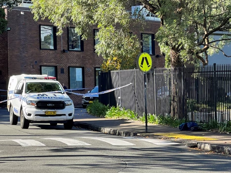 a police vehicle is seen at the scene after a 14 year old boy was arrested and a 22 year old man was taken to hospital following a stabbing incident at the university of sydney in camperdown australia photo reuters