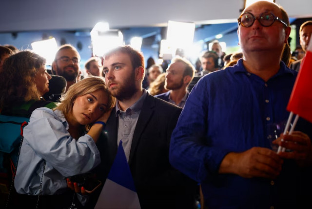 supporters of the french far right rassemblement national national rally rn party react after partial results in the second round of the early french parliamentary elections at the rn in paris france photo reuters supporters of the french far right rassemblement national national rally rn party react after partial results in the second round of the early french parliamentary elections at the rn in paris france photo reuters
