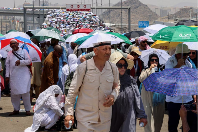 muslim pilgrims walk with umbrellas on the third day of the satan stoning ritual amid extremely hot weather during the annual haj pilgrimage in mina saudi arabia photo reuters muslim pilgrims walk with umbrellas on the third day of the satan stoning ritual amid extremely hot weather during the annual haj pilgrimage in mina saudi arabia photo reuters