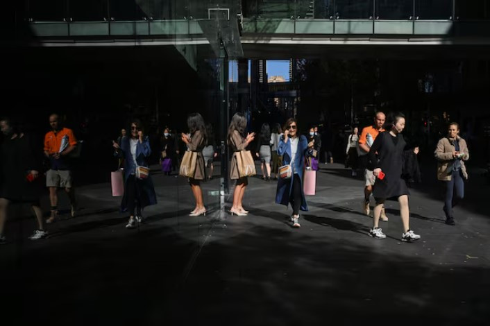 people walk outside a shopping mall in the sydney central business district in sydney australia photo reuters