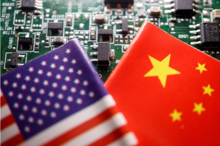 flags of china and u s are displayed on a printed circuit board with semiconductor chips photo reuters