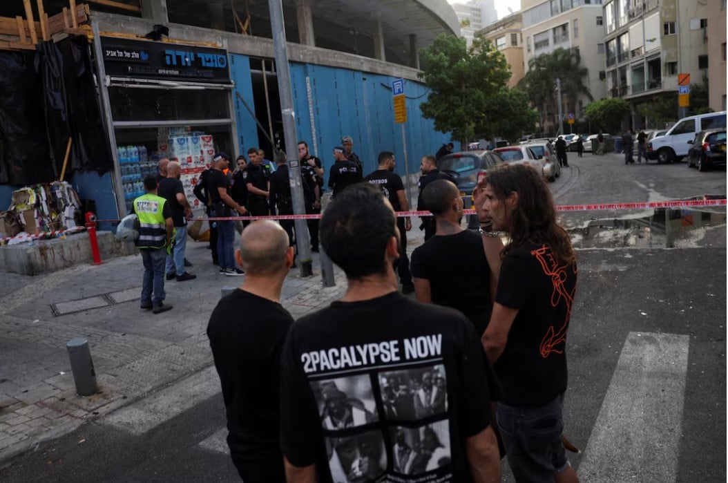 israelis gather at the site of an explosion amid the israel hamas conflict in tel aviv israel photo reuters