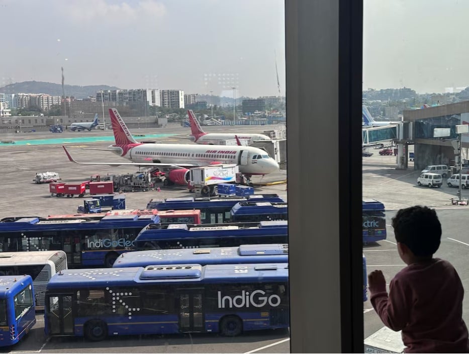 a boy looks at air india airline passenger aircrafts parked at the chhatrapati shivaji maharaj international airport in mumbai india photo reuters