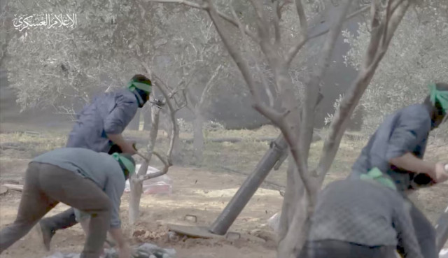 a still image taken from a video released by hamas shows what it says are its fighters firing mortar shells at israeli forces during israel s ground offensive in a location given as gaza obtained by reuters on november 7 2023 hamas military wing handout via reuters a still image taken from a video released by hamas shows what it says are its fighters firing mortar shells at israeli forces during israel s ground offensive in a location given as gaza obtained by reuters on november 7 2023 hamas military wing handout via reuters