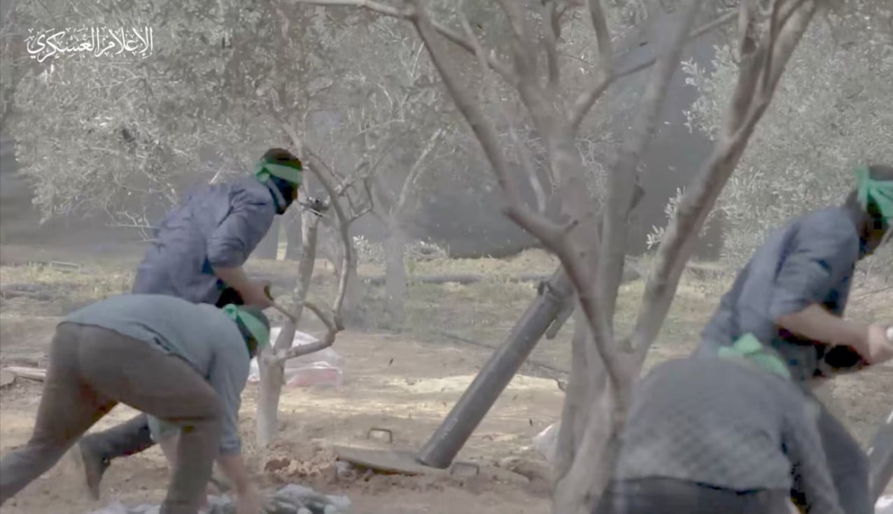 a still image taken from a video released by hamas shows what it says are its fighters firing mortar shells at israeli forces during israel s ground offensive in a location given as gaza obtained by reuters on november 7 2023 hamas military wing handout via reuters