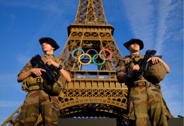 paris 2024 olympics paris 2024 olympics preview paris france july 21 2024 soldiers patrol on a street in front of the eiffel tower ahead of the olympics photo reuters paris 2024 olympics paris 2024 olympics preview paris france july 21 2024 soldiers patrol on a street in front of the eiffel tower ahead of the olympics photo reuters