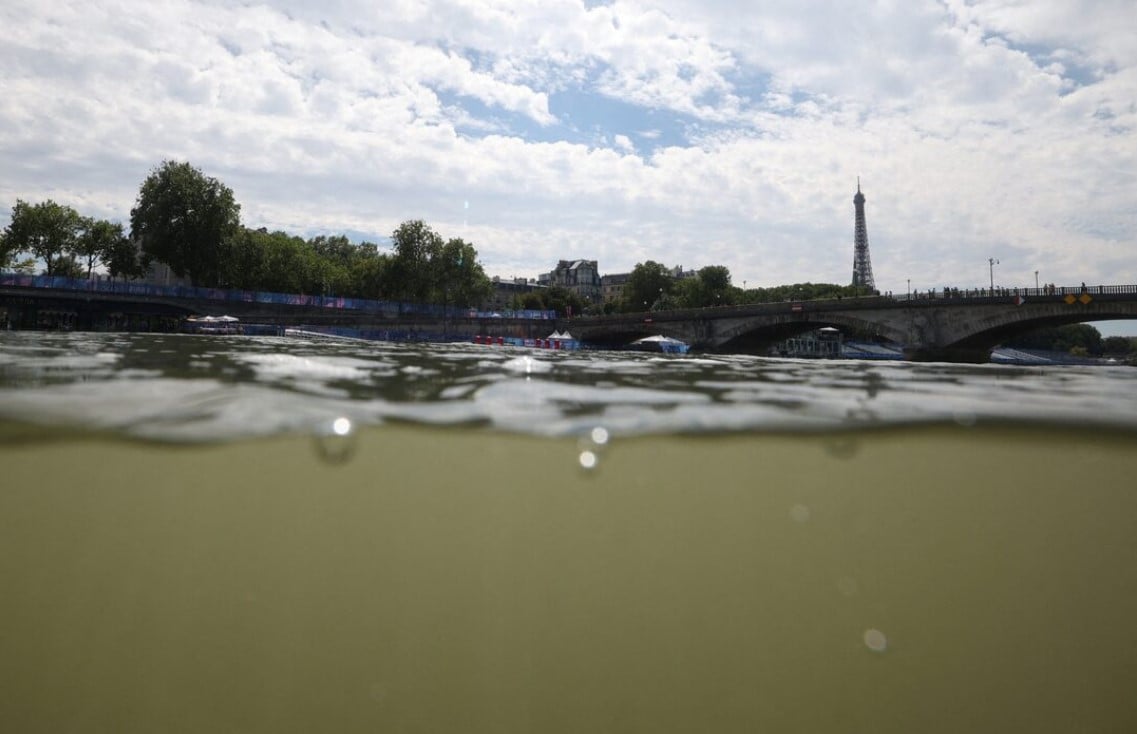 paris 2024 olympics   triathlon   alexander iii bridge paris france   july 28 2024 general view of the eiffel tower and the river seine taken from the triathlon start after training was cancelled amid water quality concerns photo reuters