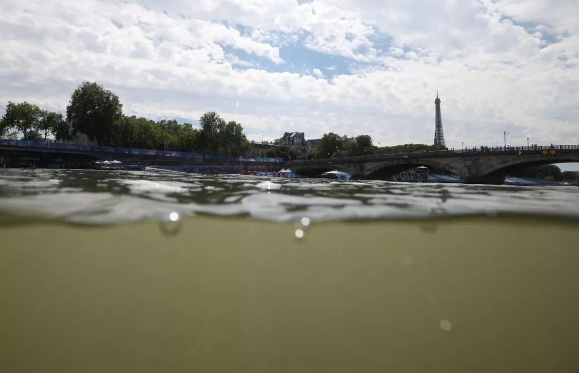 paris 2024 olympics triathlon alexander iii bridge paris france july 28 2024 general view of the eiffel tower and the river seine taken from the triathlon start after training was cancelled amid water quality concerns photo reuters paris 2024 olympics triathlon alexander iii bridge paris france july 28 2024 general view of the eiffel tower and the river seine taken from the triathlon start after training was cancelled amid water quality concerns photo reuters