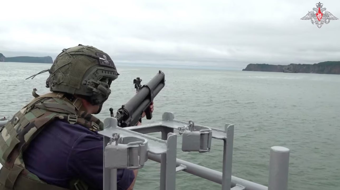 a russian service member fires from aboard a warship during naval exercises at an undisclosed location in this still image from a video released july 30 2024 russian defence ministry handout via reuters