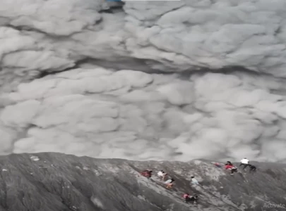 watch climbers scramble for safety as indonesia s mount dukono erupts