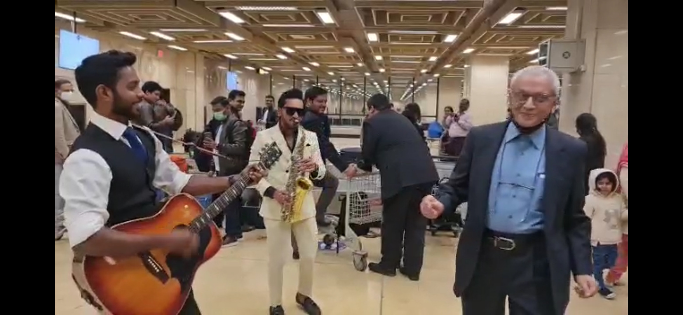 tis the season to be jolly musical duo performs christmas classic at karachi airport