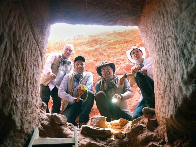 dr fares braizat from left fadi balawi josh gates and dr pearce paul creasman look into the newly discovered tomb at petra photo discovery s expedition unknown