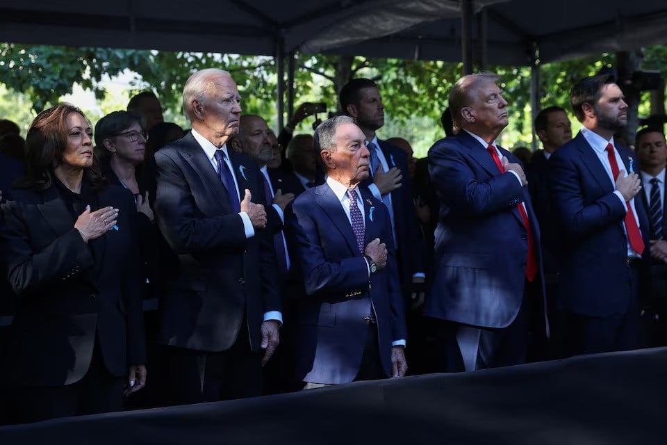 republican presidential nominee and former president donald trump republican vice presidential nominee senator jd vance president joe biden and former mayor of new york city michael bloomberg and democratic presidential nominee and vice president kamala harris gesture during a ceremony marking the 23rd anniversary of the september 11 2001 attacks on september 24 2024 photo reuters