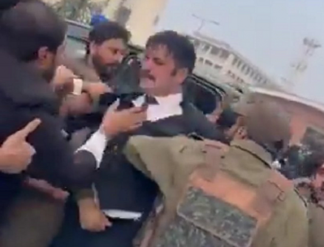 pti leader sher afzal marwat can be seen being dragged by police officials as a lawyer tries to hold on to him photo screengrab pti leader sher afzal marwat can be seen being dragged by police officials as a lawyer tries to hold on to him photo screengrab