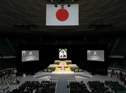 with flowers and a gun salute japan bids farewell to abe at state funeral