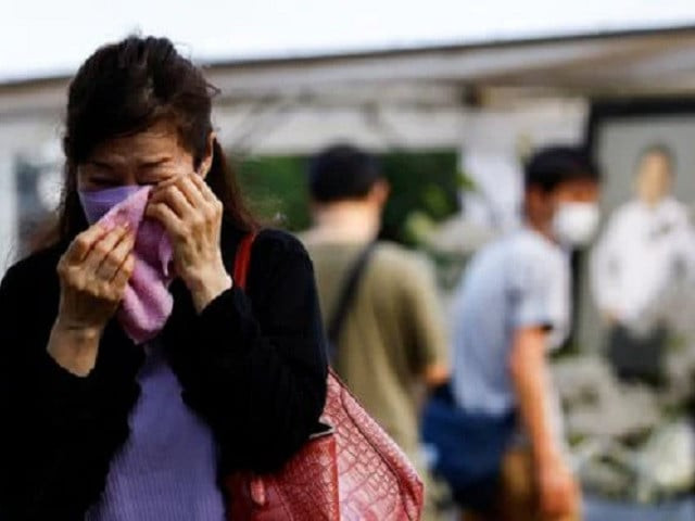 japan bids sombre farewell to shinzo abe