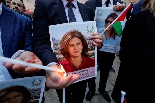 people light candles during a vigil in memory of al jazeera journalist shireen abu akleh who was killed during an israeli raid outside the church of the nativity in bethlehem in the israeli occupied west bank may 16 2022 photo reuters people light candles during a vigil in memory of al jazeera journalist shireen abu akleh who was killed during an israeli raid outside the church of the nativity in bethlehem in the israeli occupied west bank may 16 2022 photo reuters