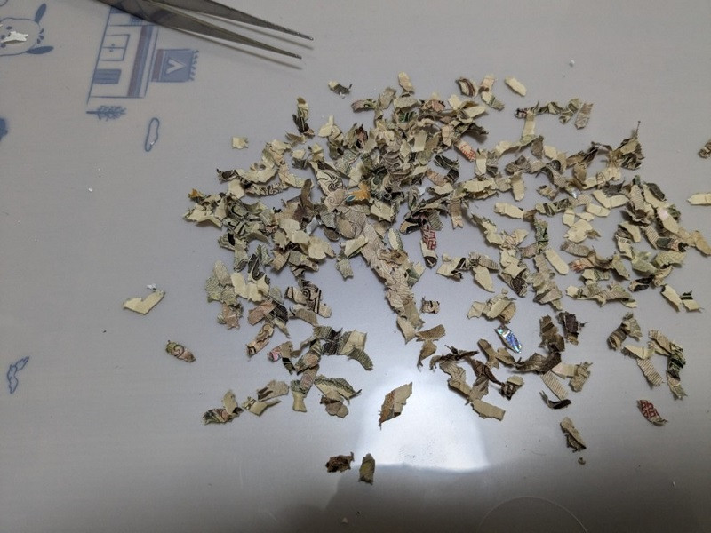 Japanese X user ‘Tomo’ put back together a 10,000 yen bill that had been shredded. PHOTO: X/@C8kCGa5jT0LlbuA