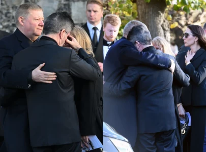 simon cowell mourns liam payne with heartfelt hug at the funeral